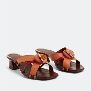 TORY BURCH
Knotted heeled mules size 7 brand new